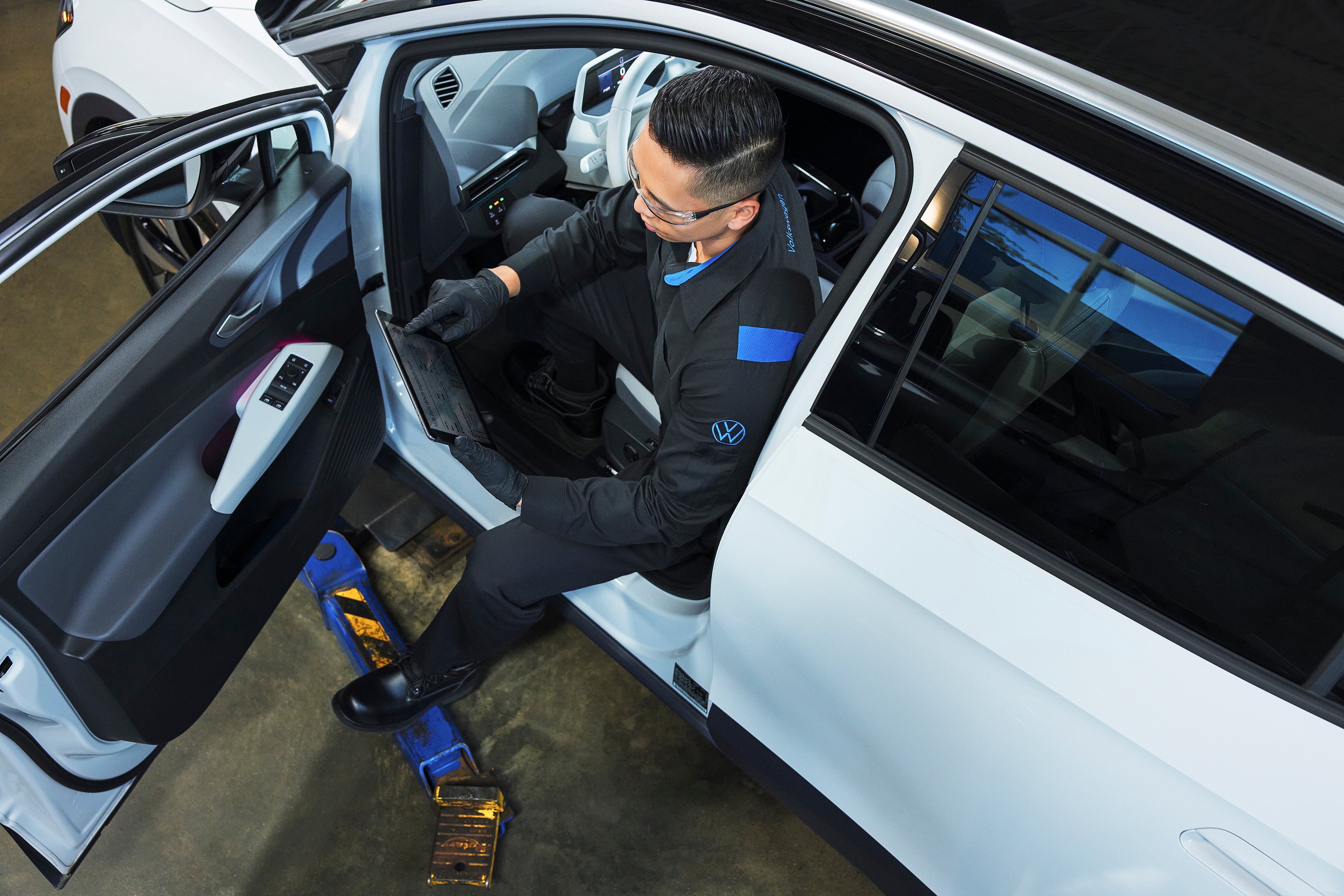Ford technician inspecting a vehicle
