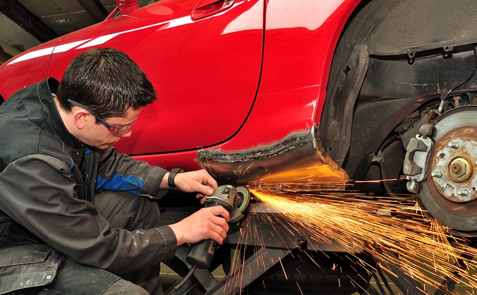 Ford technician performing vehicle service