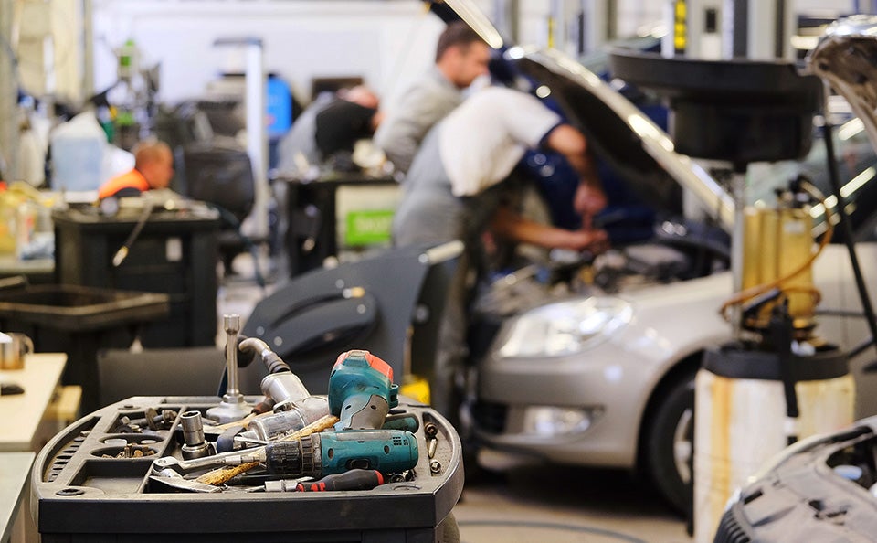 Ford technician performing vehicle service