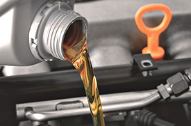 Ford technician performing an oil change