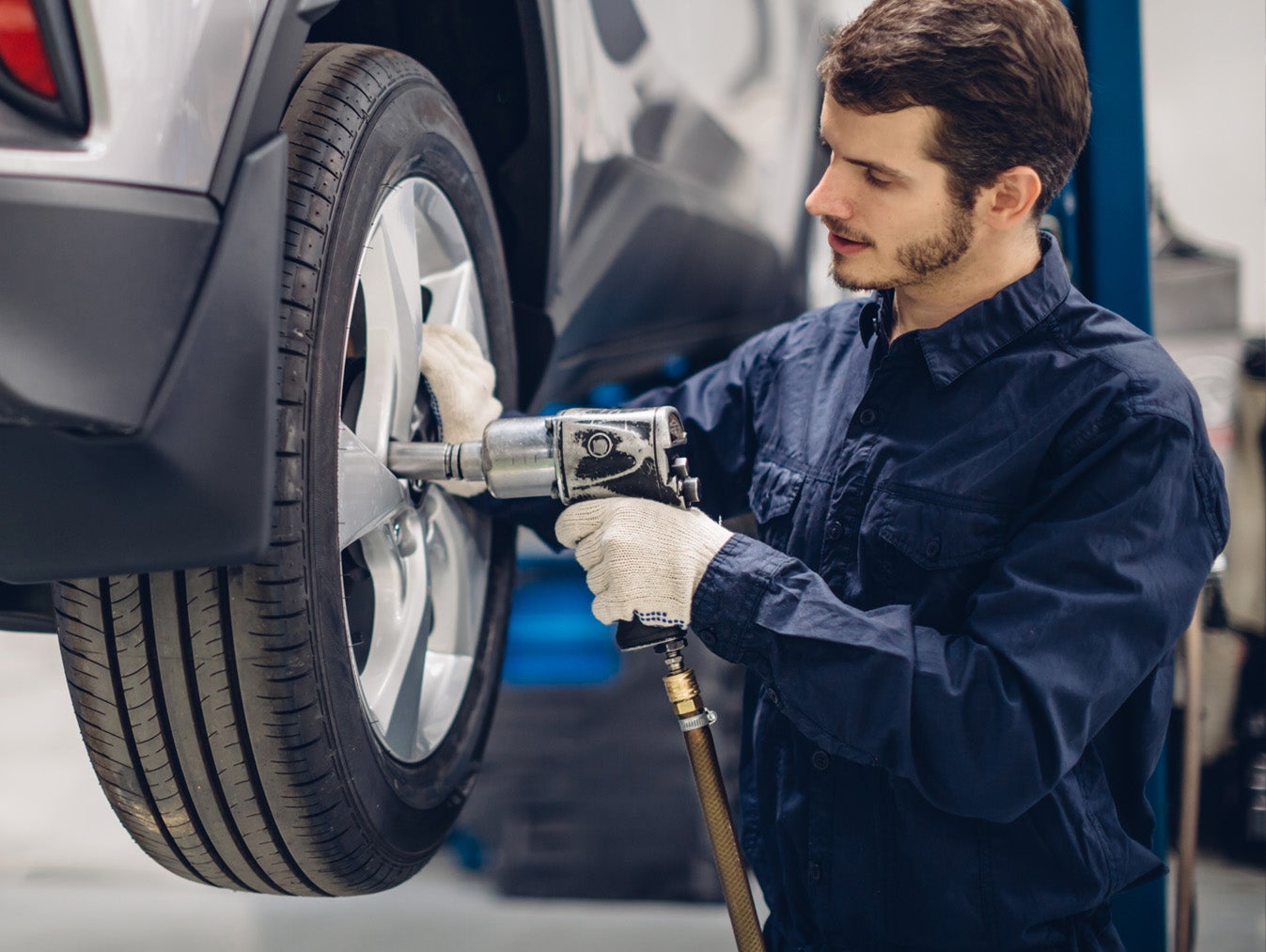 Technician servicing tires on a Ford vehicle
